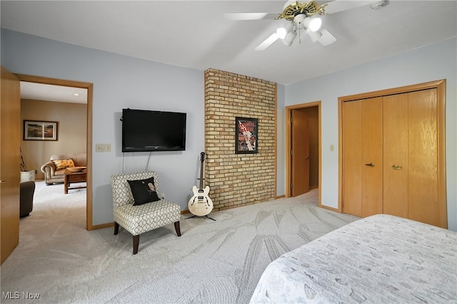 bedroom with a closet, a ceiling fan, and carpet flooring