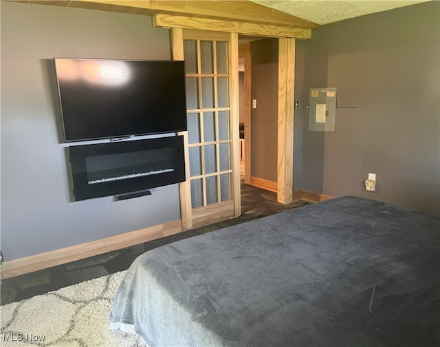 bedroom with baseboards and carpet