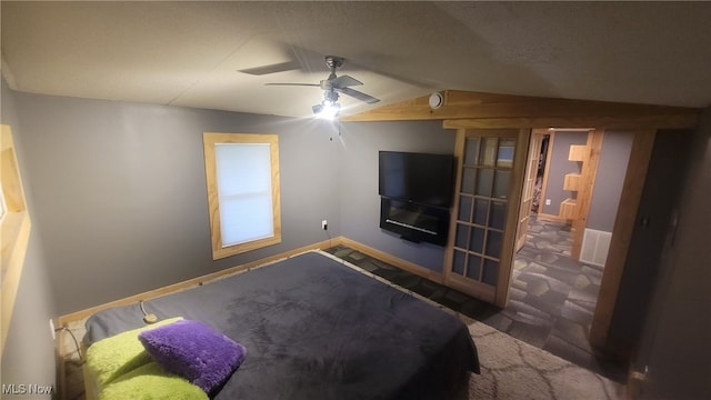 bedroom with ceiling fan, visible vents, baseboards, vaulted ceiling, and carpet