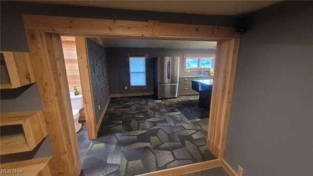 1376 Fairview Ave, Atwater, OH 44201 - hallway with a sink, baseboards, and dark carpet