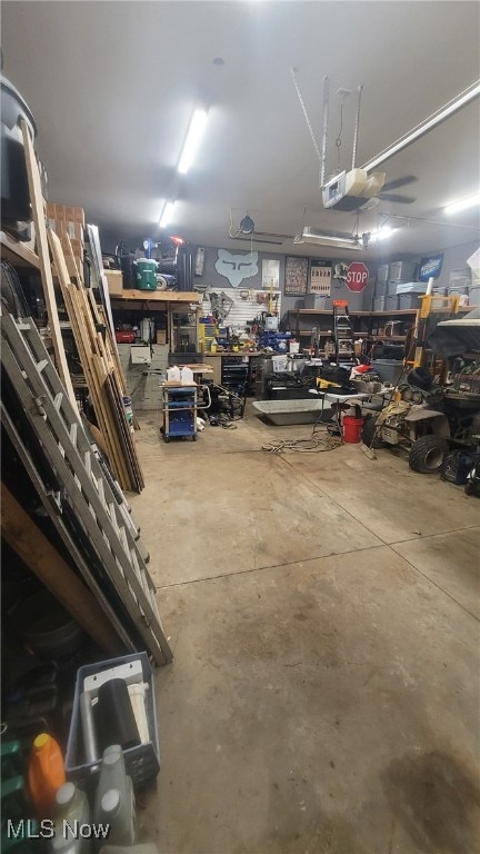 garage featuring a workshop area and a garage door opener