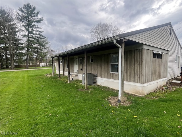 1376 Fairview Ave, Atwater, OH 44201 - view of home's exterior with central AC unit and a lawn