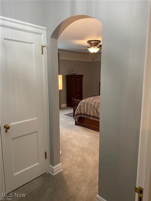 3016 Croydon Dr NW, Canton, OH 44718 - bedroom with baseboards, arched walkways, a ceiling fan, and carpet floors