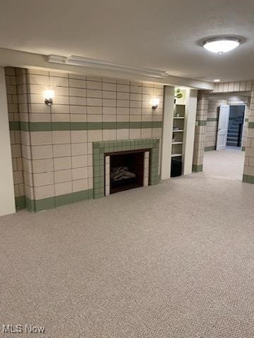 3016 Croydon Dr NW, Canton, OH 44718 - unfurnished living room featuring carpet and a fireplace