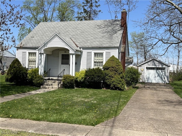 201 Gilcher Ct, Sandusky, OH 44870 - view of front of house featuring a chimney, driveway, an outdoor structure, a detached garage, and a front yard