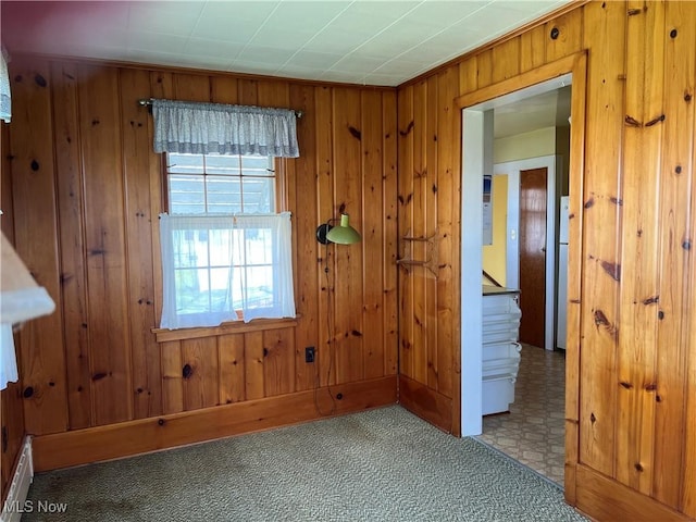 201 Gilcher Ct, Sandusky, OH 44870 - unfurnished room featuring stairway, baseboard heating, wooden walls, and carpet