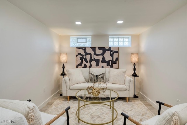 living area with baseboards and recessed lighting