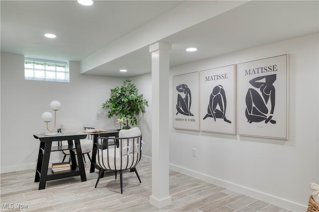 interior space featuring baseboards, wood finished floors, and recessed lighting