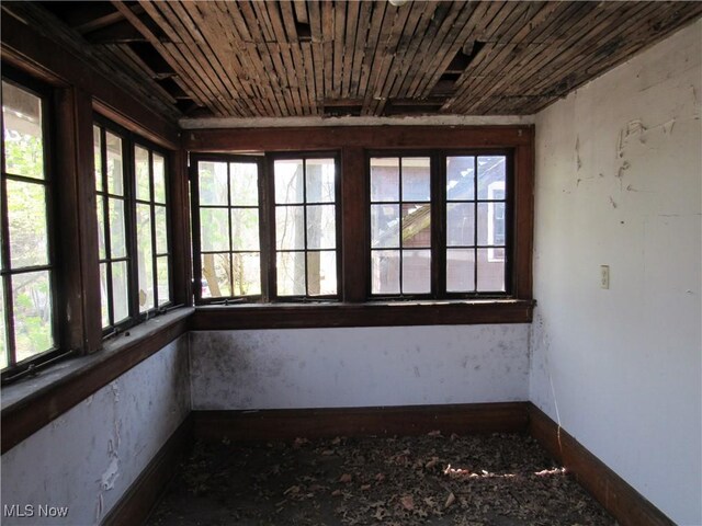 325 Hillwood Dr, Akron, OH 44320 - unfurnished sunroom with baseboards