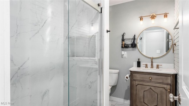 bathroom with toilet, vanity, and a marble finish shower