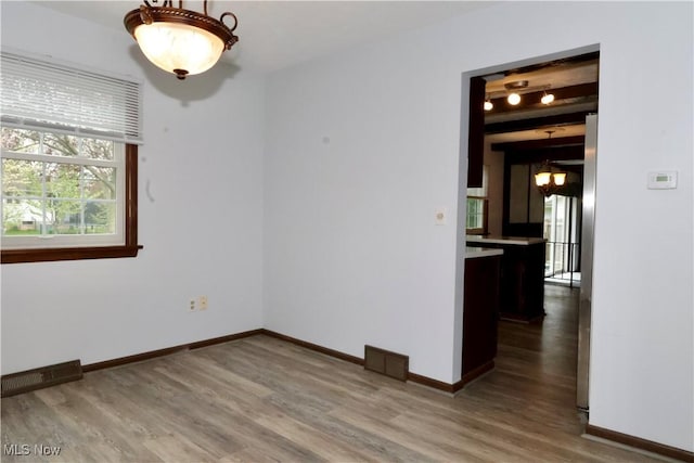 4479 Azalea Ln, North Olmsted, OH 44070 - unfurnished room with visible vents, baseboards, and wood finished floors