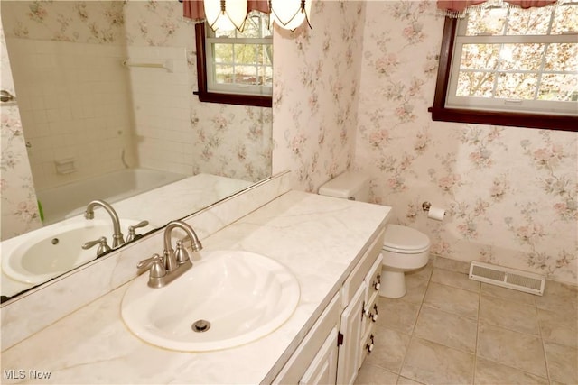 4479 Azalea Ln, North Olmsted, OH 44070 - full bath with tile patterned flooring, toilet, vanity, and visible vents