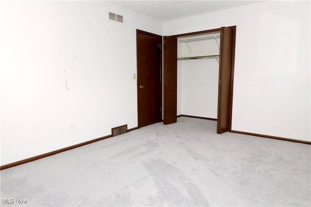 4479 Azalea Ln, North Olmsted, OH 44070 - unfurnished bedroom featuring light carpet, visible vents, and a closet