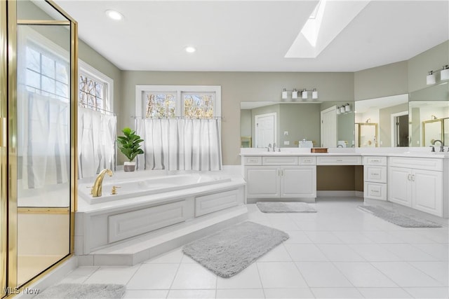 full bath with a garden tub, a skylight, a stall shower, and vanity