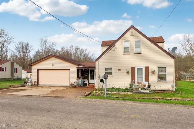 944 Bey Rd, Akron, OH 44312 - view of front of home featuring an attached garage and concrete driveway