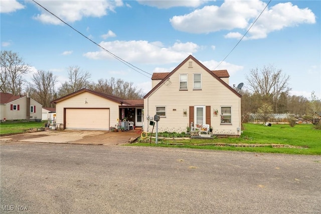 944 Bey Rd, Akron, OH 44312 - view of front facade featuring driveway, an attached garage, and a front lawn