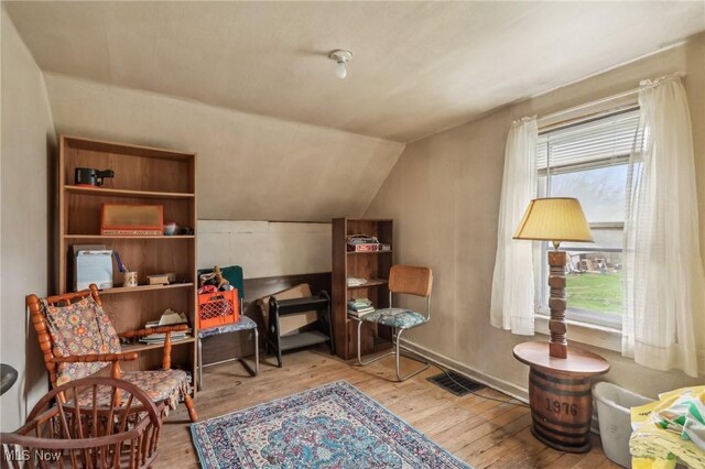 944 Bey Rd, Akron, OH 44312 - living area with wood finished floors and lofted ceiling