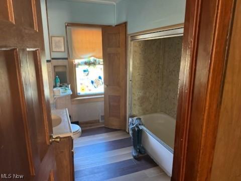 944 Bey Rd, Akron, OH 44312 - full bathroom featuring vanity and wood finished floors