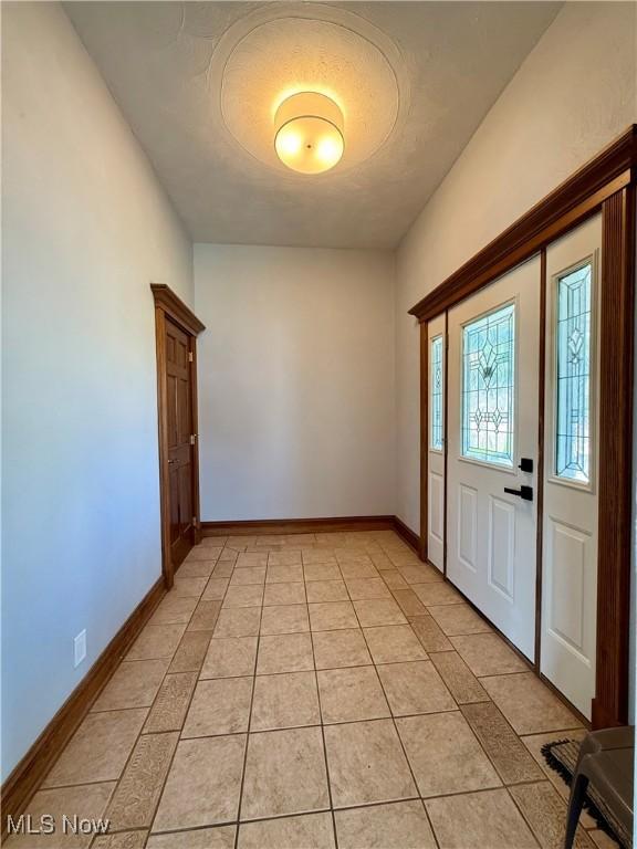 609 Main St, Toronto, OH 43964 - entrance foyer featuring baseboards and light tile patterned floors