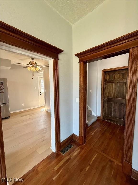 609 Main St, Toronto, OH 43964 - hallway with wood-type flooring, baseboards, and lofted ceiling