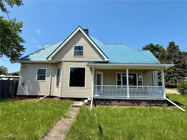 609 Main St, Toronto, OH 43964 - view of front of house with a chimney, covered porch, and metal roof