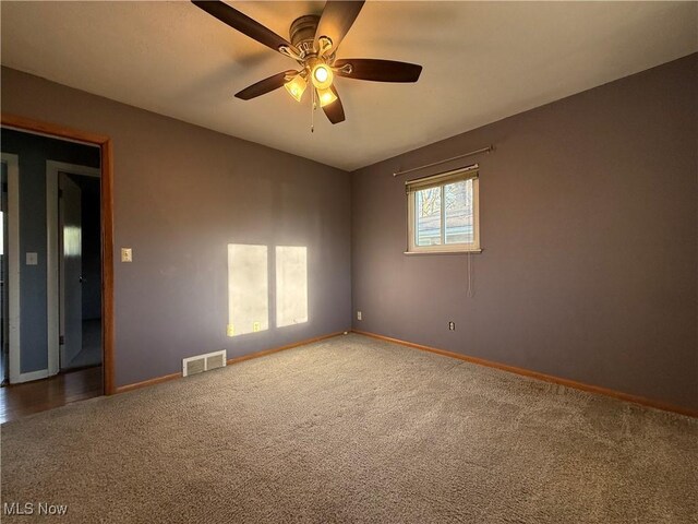 9083 Priem Rd, Strongsville, OH 44149 - spare room featuring carpet floors, visible vents, baseboards, and ceiling fan
