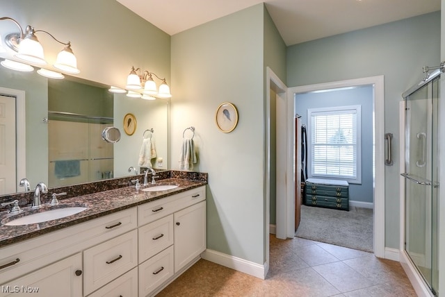 bathroom with a sink and a shower stall