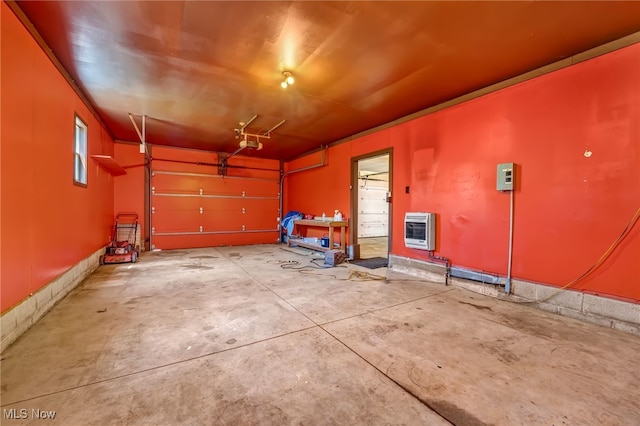 garage with heating unit and a garage door opener
