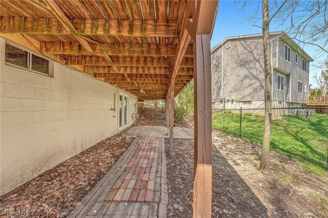 view of patio / terrace featuring fence