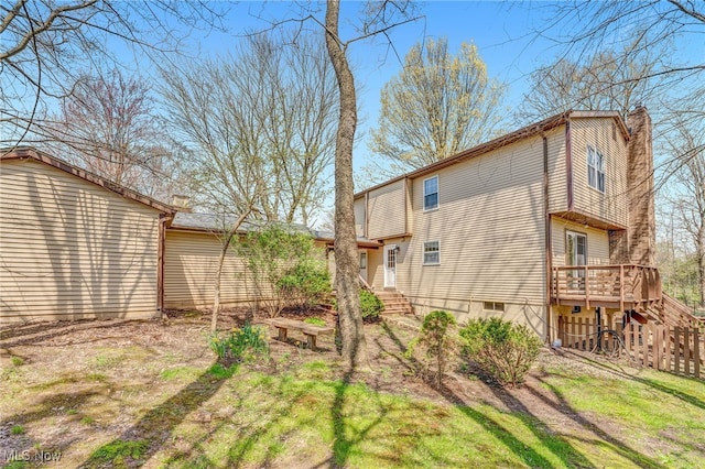 view of yard featuring fence and a wooden deck