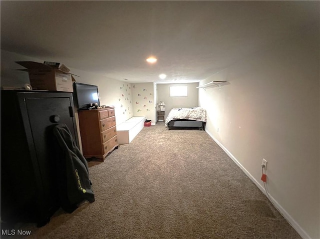 bedroom featuring carpet floors and baseboards