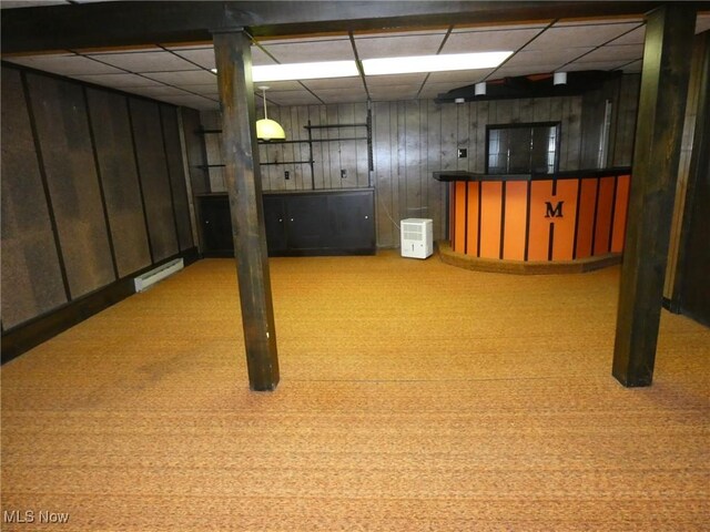 403 Sandy Dr, Cambridge, OH 43725 - finished below grade area with a baseboard radiator, wooden walls, carpet flooring, and a paneled ceiling