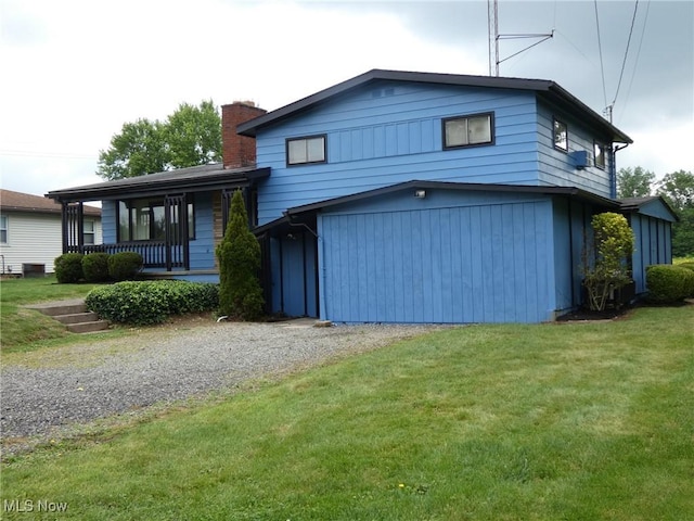 403 Sandy Dr, Cambridge, OH 43725 - tri-level home featuring driveway, an attached garage, a chimney, and a front lawn