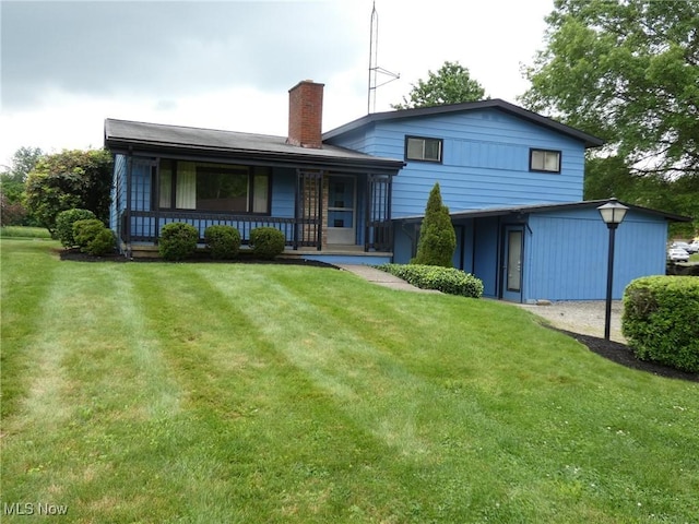 403 Sandy Dr, Cambridge, OH 43725 - rear view of house with a yard, a porch, and a chimney