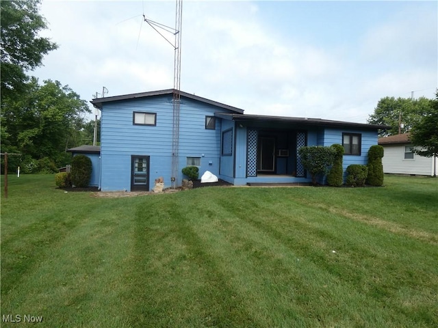 403 Sandy Dr, Cambridge, OH 43725 - back of house featuring a lawn