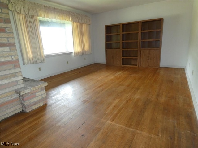 403 Sandy Dr, Cambridge, OH 43725 - unfurnished room with wood finished floors and baseboards
