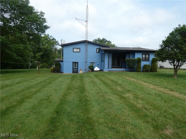 403 Sandy Dr, Cambridge, OH 43725 - rear view of property with a yard