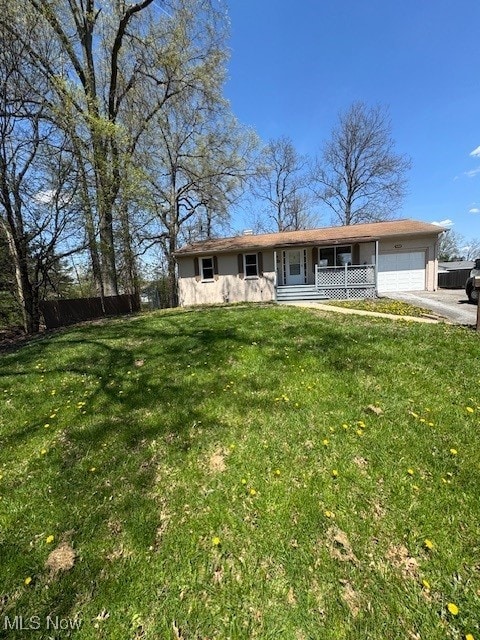 5742 Baylor, Youngstown, OH 44515 - ranch-style home featuring a garage, driveway, a front lawn, and covered porch