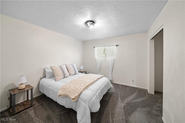 207 Maplewood Dr, Cadiz, OH 43907 - carpeted bedroom with baseboards and a textured ceiling