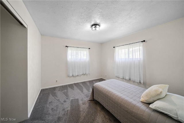 207 Maplewood Dr, Cadiz, OH 43907 - bedroom with carpet floors, a textured ceiling, and baseboards