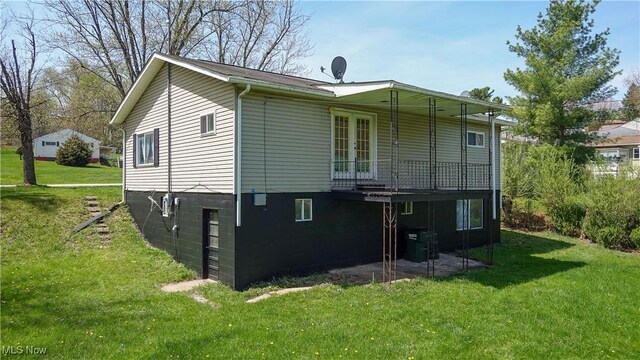207 Maplewood Dr, Cadiz, OH 43907 - back of property with a lawn, french doors, and a patio