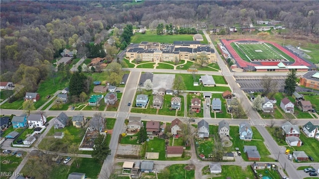 353 W N Ave, East Palestine, OH 44413 - aerial view of property and surrounding area featuring a heavily wooded area