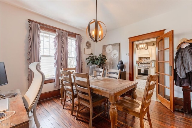 353 W N Ave, East Palestine, OH 44413 - dining space with a chandelier, wood-type flooring, and baseboards