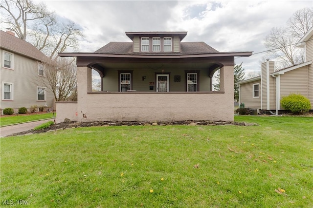 353 W N Ave, East Palestine, OH 44413 - bungalow-style home with a front lawn, covered porch, and a shingled roof