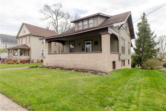 353 W N Ave, East Palestine, OH 44413 - bungalow-style home featuring a front lawn and covered porch
