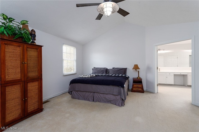 bedroom featuring a ceiling fan, connected bathroom, carpet, baseboards, and lofted ceiling