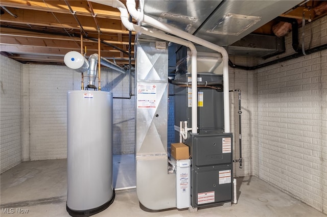 utility room featuring water heater and heating unit