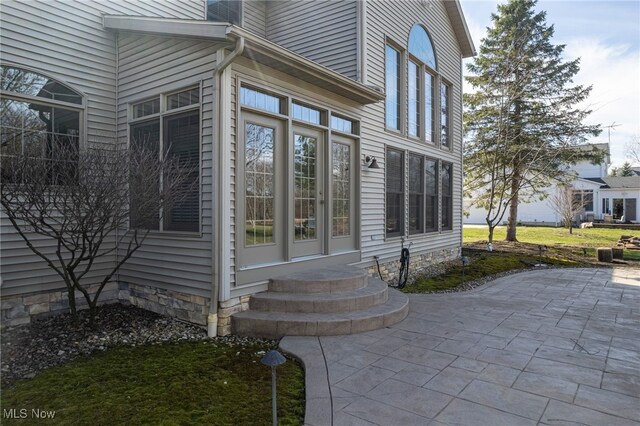 entrance to property with a patio area