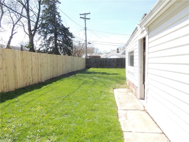 view of yard featuring a fenced backyard