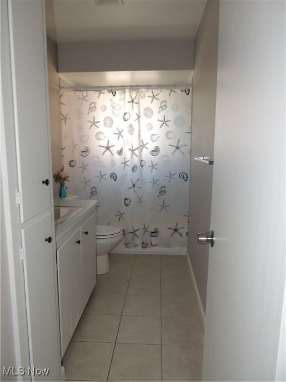 full bath with vanity, curtained shower, toilet, tile patterned flooring, and visible vents